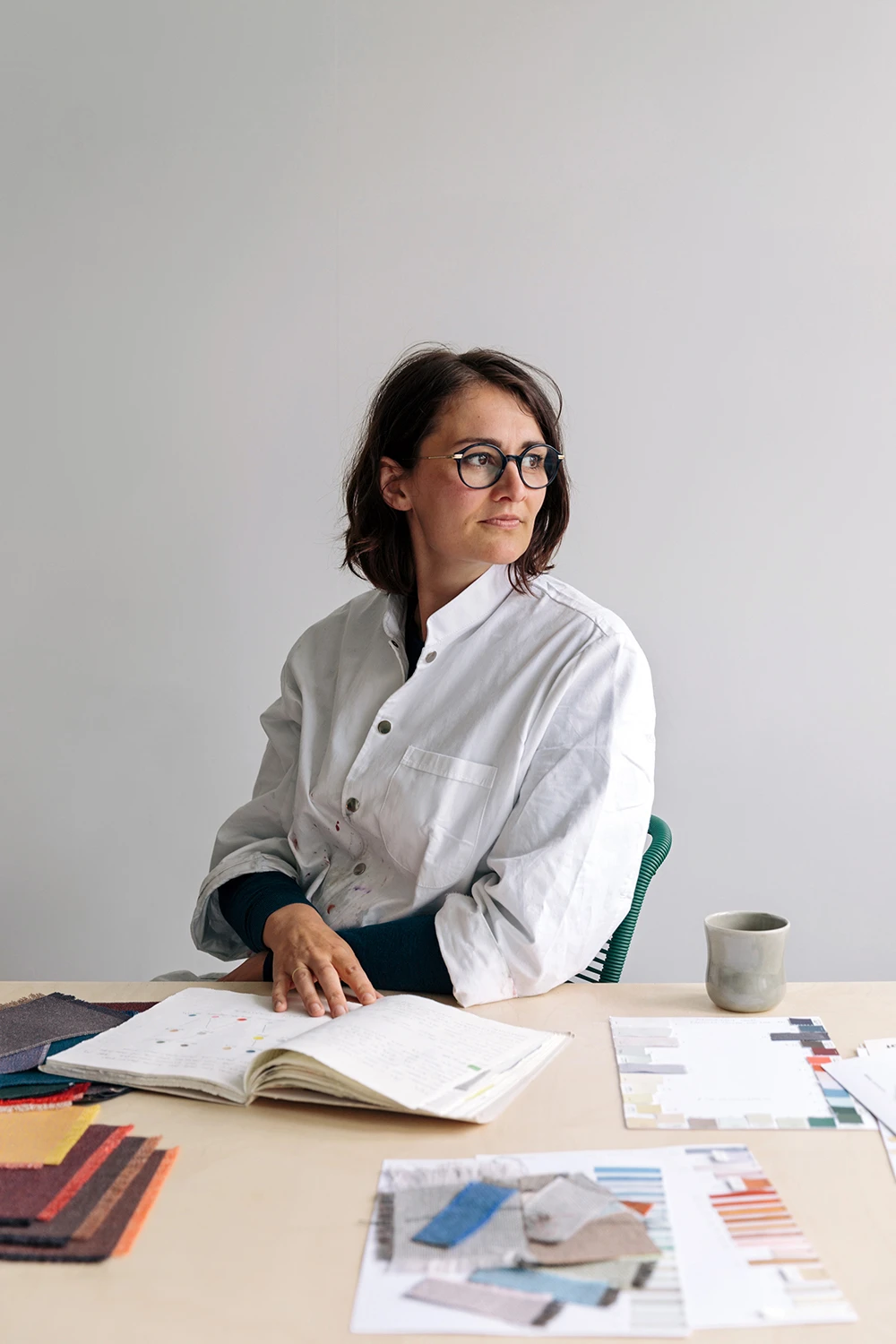 AGS controller reviewing client documents at her desk