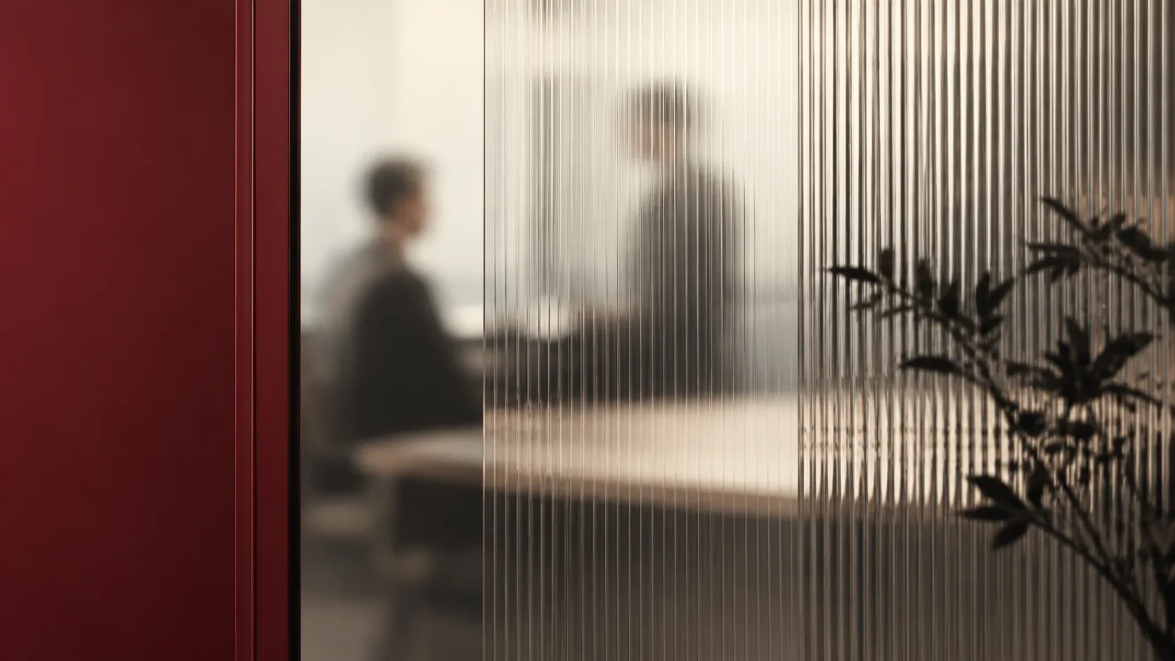 Go-live meeting seen through a glass partition
